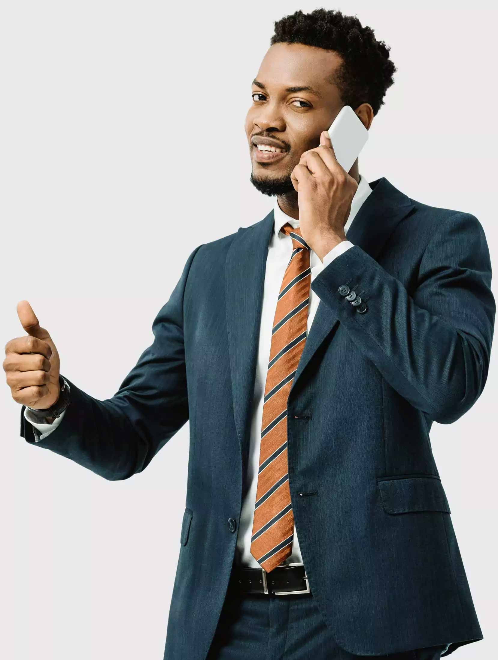 Businessman on phone with a thumbs up